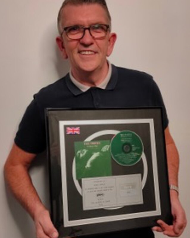 The Smiths' Drummer Mike Joyce Raffles 'The Queen Is Dead' Platinum Disc In Support Of Back on Track