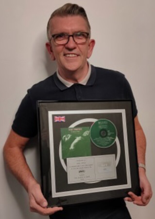 The Smiths' Drummer Mike Joyce Raffles 'The Queen Is Dead' Platinum Disc In Support Of Back on Track
