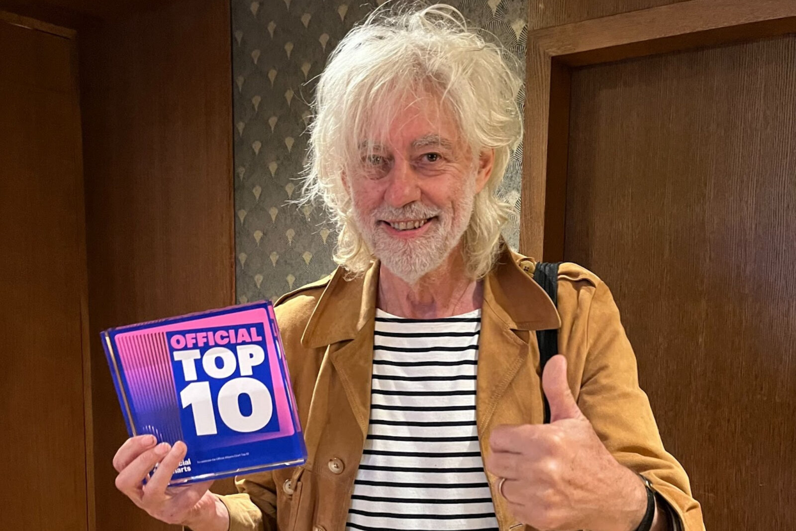 Official Charts award for Live Aid musical album featuring songs by Bob Geldof, U2, Brian May, Sting and Madonna